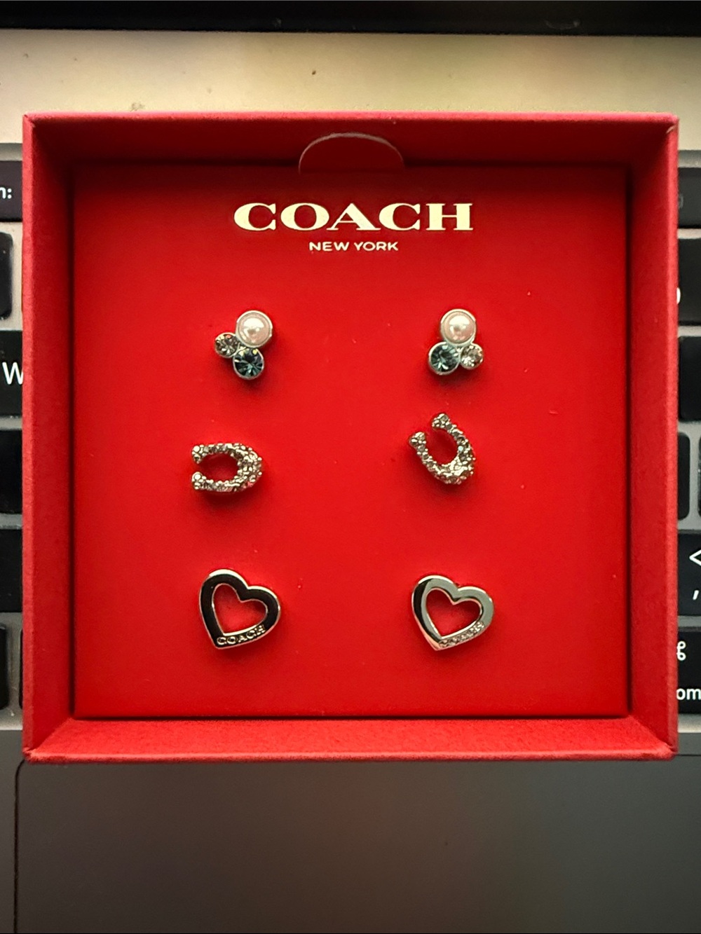 Coach stud earrings